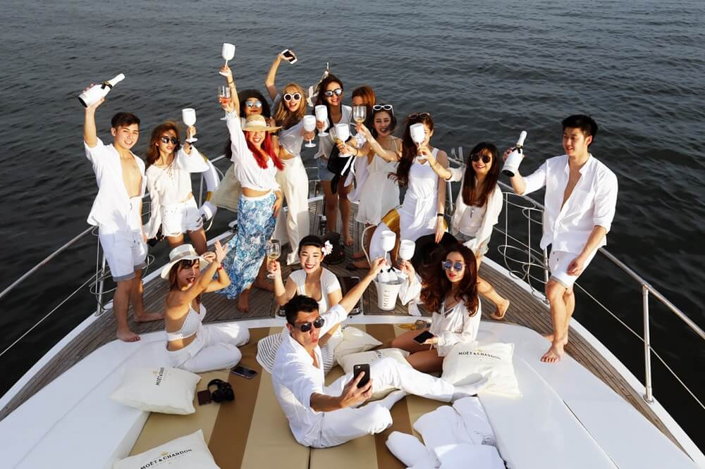 Group celebrating on a yacht deck
